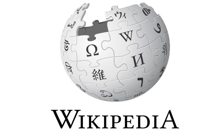 The image depicts the iconic logo of Wikipedia. It features a globe - shaped structure composed of interlocking puzzle pieces. Each puzzle piece is inscribed with various characters and symbols from different writing systems around the world, such as the Greek letter omega (Ω), the Latin - based "W" representing Wikipedia, and Chinese characters like "維". There is a noticeable gap in the puzzle, symbolizing the continuous and ever - expanding nature of knowledge. Below the globe, the word "WIKIPEDIA" is prominently displayed in bold, black letters. This logo effectively conveys the global and inclusive spirit of Wikipedia as a vast repository of human knowledge.