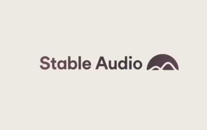 The image depicts the logo of "Stable Audio." The text "Stable Audio" is written in a bold, sans-serif font in a dark - brownish color. To the right of the text, there is a stylized, semi - circular icon with two small, inverted V - shaped elements inside it, resembling hills or waves. The background of the image is a light, neutral shade, providing a clean and simple backdrop that makes the logo stand out clearly.