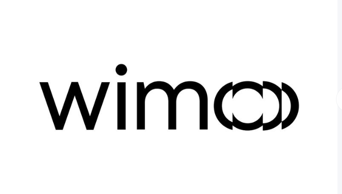 Alt description: Minimalist black and white logo featuring the word "wimco", with the "o" character repeated and overlapping to create a sense of motion or progression, suitable for modern branding and visual identity.